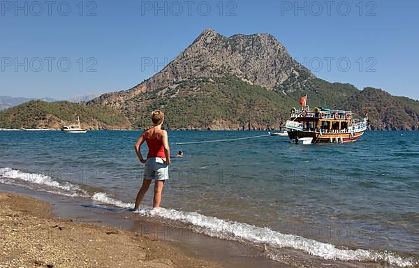 Woman looking at ship