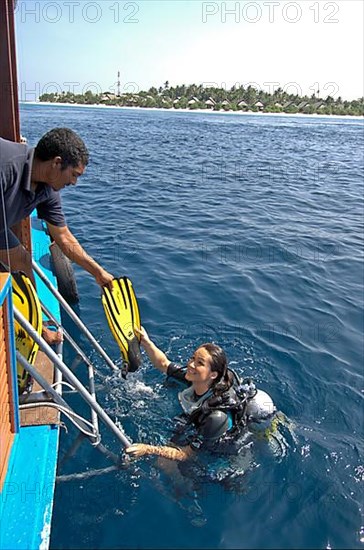 Diver boards boat