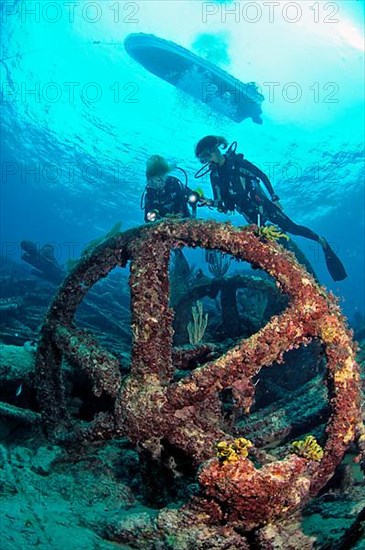 Diver on wreck with steel rudder