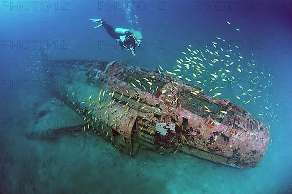 Divers at wreckage of McDonnell Douglas F-4 Phantom military aircraft