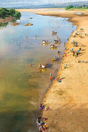 People washing and taking water from the Mandare River