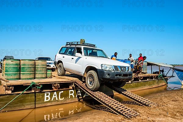 Four-wheel drive car unloading from a ferry