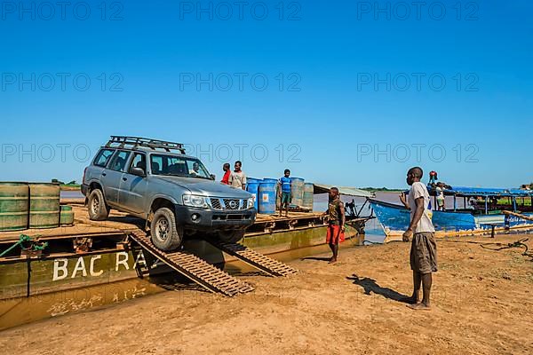 Four-wheel drive car unloading from a ferry
