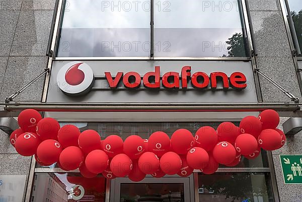 Red balloons at a Vodafone branch