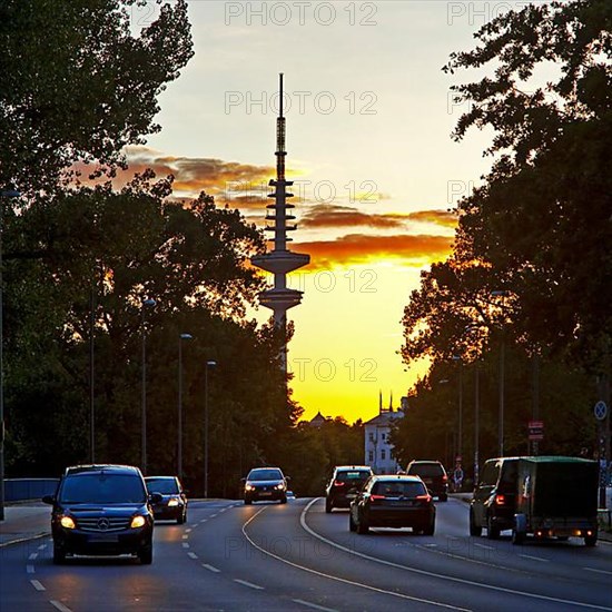 Cars on the Kennedy Bridge in front of the Heinrich Hertz Tower at sunset
