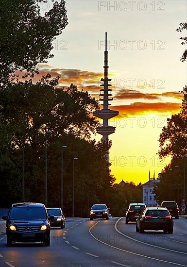 Cars on the Kennedy Bridge in front of the Heinrich Hertz Tower at sunset