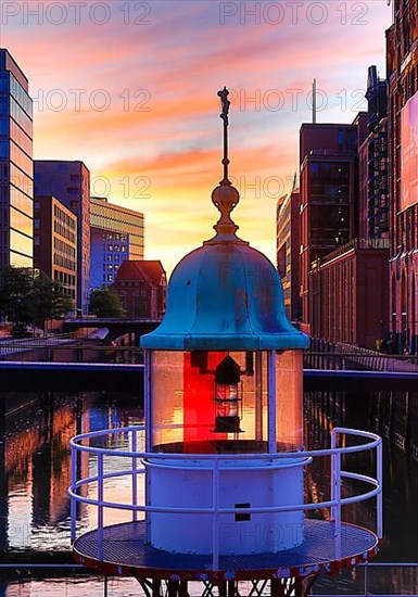 Former lighthouse in front of the International Maritime Museum Hamburg at sunrise