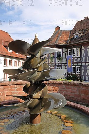 Ornamental fountain with ship's propeller in front of the Old Official House in Neckarsteinach