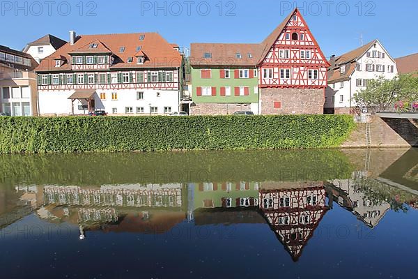 Reflection of the half-timbered houses in the Nagold at the wine bridge in Calw