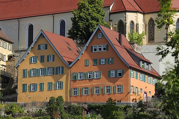 Yellow and orange house in front of the collegiate church in Horb am Neckar