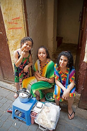 Young Moroccan coffee and cake sellers in the old town