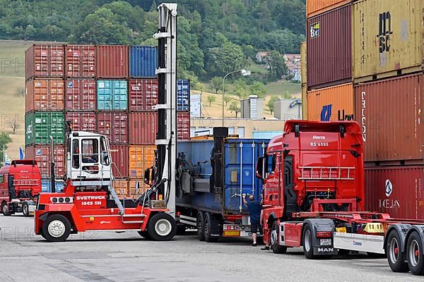 Container stacker loading freight containers