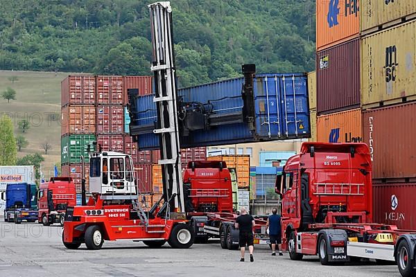 Container stacker loading freight containers