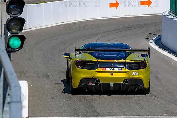 Racing car Sports car Ferrari 488 Challenge has green light to exit pit lane Pit Lane on racetrack