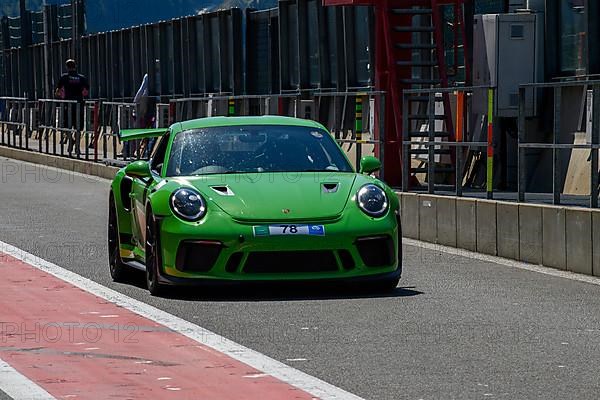 Green racing car Sports car Porsche 911 GT3 RS in pit lane Pit Lane of race track