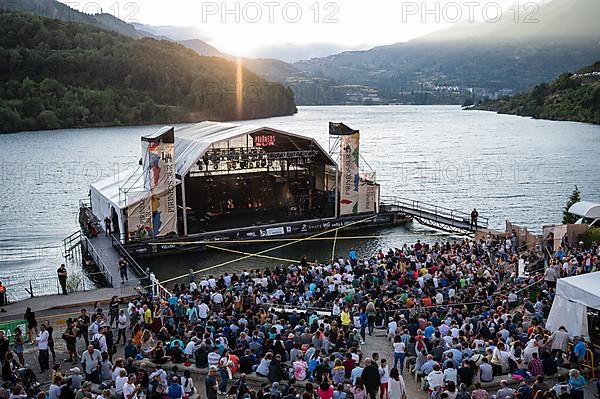 Floating stage on Lanuza reservoir at Pirineos Sur International Festival of Cultures in Sallent de Gallego