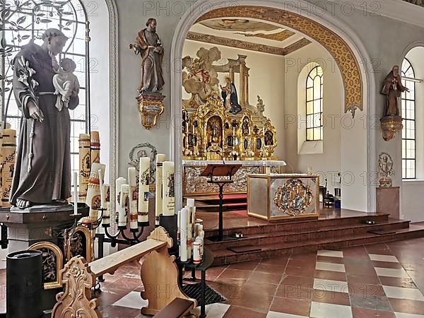 Figure of St. Anthony of Padua and votive candles