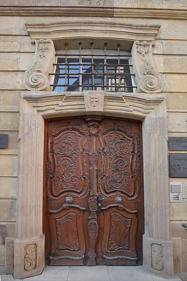 Door with wood carving on the convent house built in 1765 in Bad Wimpfen