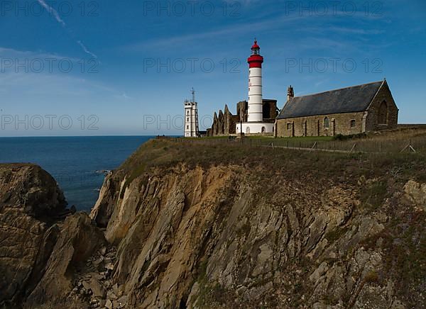 The lighthouse Phare de Saint-Mathieu with the chapel Notre Dame de Grace of Our Lady of Grace in the department of Finistere at the western tip of Brittany