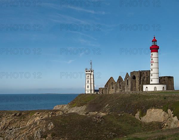 The lighthouse Phare de Saint-Mathieu with the chapel Notre Dame de Grace of Our Lady of Grace in the department of Finistere at the western tip of Brittany