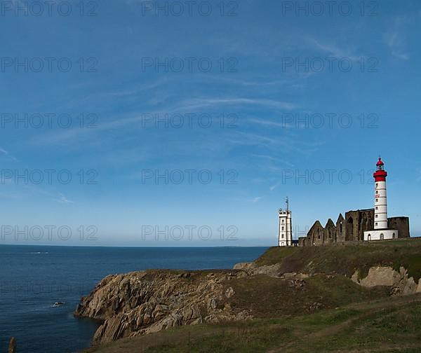 The lighthouse Phare de Saint-Mathieu with the chapel Notre Dame de Grace of Our Lady of Grace in the department of Finistere at the western tip of Brittany