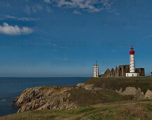 The lighthouse Phare de Saint-Mathieu with the chapel Notre Dame de Grace of Our Lady of Grace in the department of Finistere at the western tip of Brittany