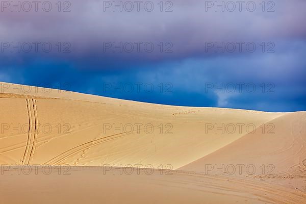 White sand dunes before storm