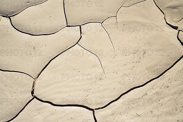 Cracked clay mud in dried up river bed