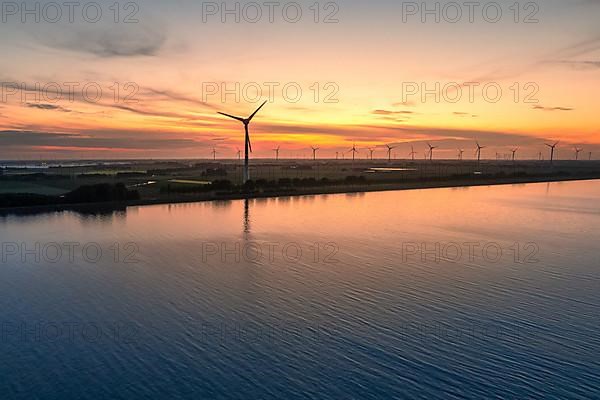 Aerial view of a wind farm at sunset