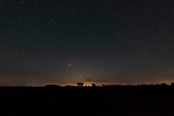 Starry sky with shooting star