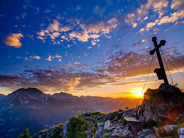 Summit cross of the Brettgabel at sunset