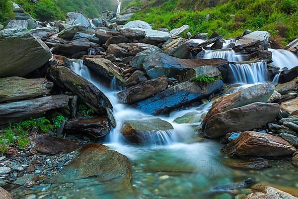 Cascade of Bhagsu waterfall in Himalayas. Bhagsu