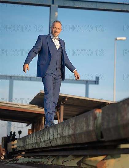 Mafia Boss in blue suit at the harbour