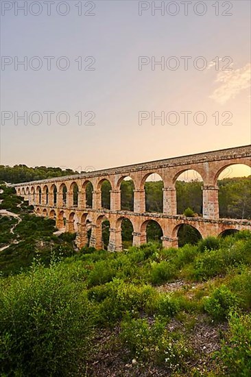 Old roman aqueduct at sunrise