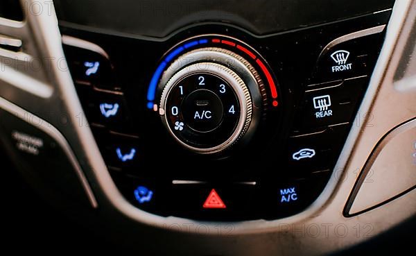 Front view of a car air conditioning control panel. Air conditioning knob of a car. Close up of automotive air conditioning switch panel