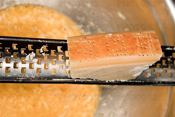 Parmesan is freshly grated into the beaten eggs for a carbonara