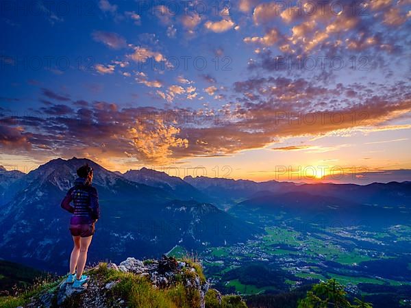 Mountaineer looking at sunset