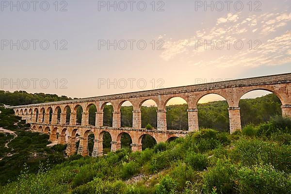 Old roman aqueduct at sunrise