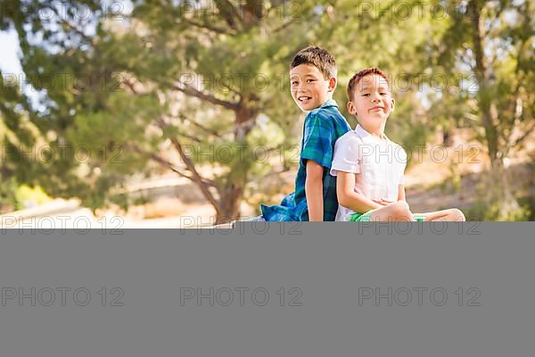 Outdoor portrait of biracial chinese and caucasian brothers