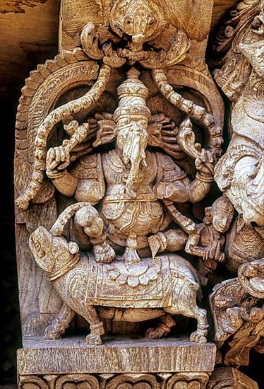 Lord Ganesh Ganpati riding on Rat Mouse Mushika. 17th century wooden carvings in Meenakashi Sundareswarer temple's chariot at Madurai