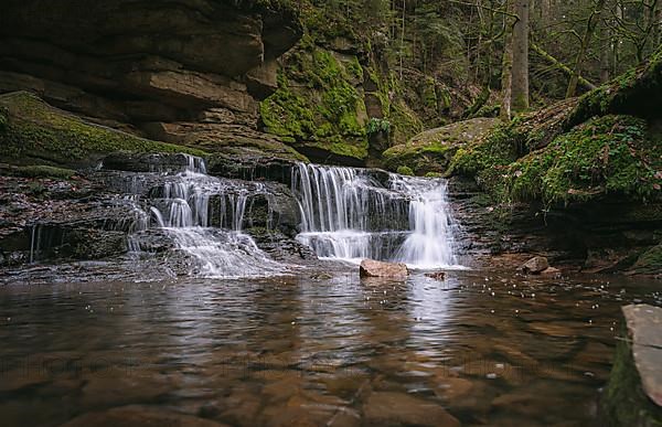 Waterfall with rocks in the forest