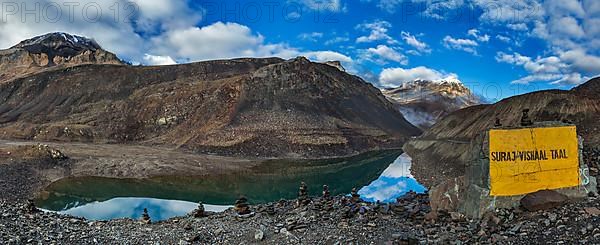 Panorama of mountain lake Suraj Tal in Himalayas on Manali-Leh road on sunrise. Lahaul valley