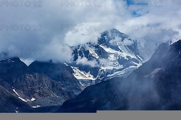 Severe HImalayas mountains in clouds. India