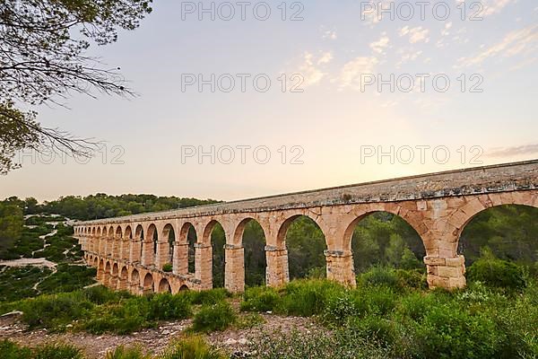 Old roman aqueduct at sunrise