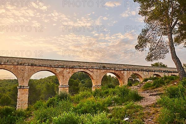 Old roman aqueduct at sunrise