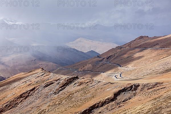 Road in Himalayas in clouds near Tanglang la Pass