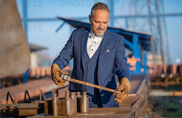 Mafia boss with rough tools at the harbour