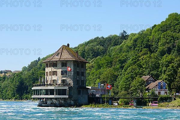 Schloessli Woerth with flag of Switzerland at the Rhine Falls