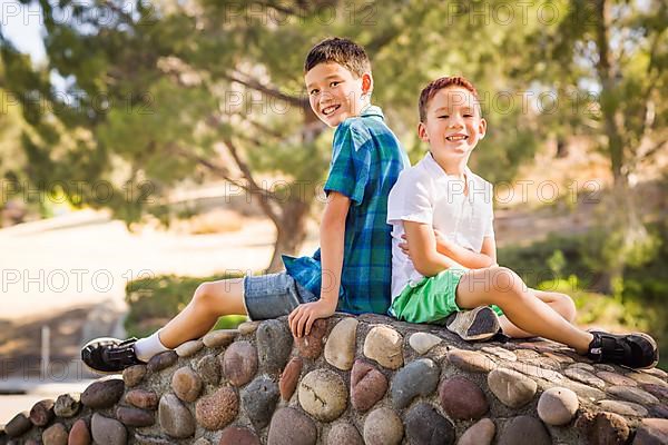 Outdoor portrait of biracial chinese and caucasian brothers