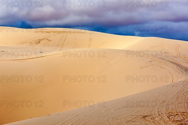 White sand dunes before storm